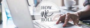 image of a woman's hand scrolling on computer's pad with the caption "how we roll" in the middle